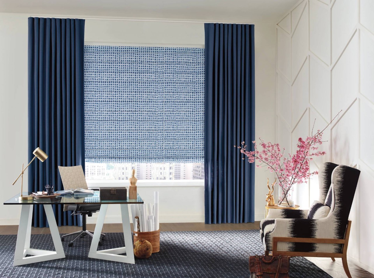 Home office decorated with pink cherry blossoms and blue Hunter Douglas Roman Shades near Bainbridge Island, WA