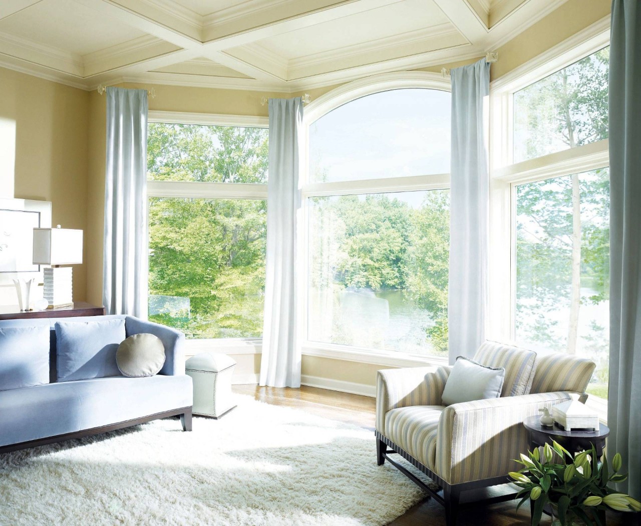 Bright home interior with large windows, decorated with Hunter Douglas Silhouette® Sheer Shadings, near Bainbridge Island, WA