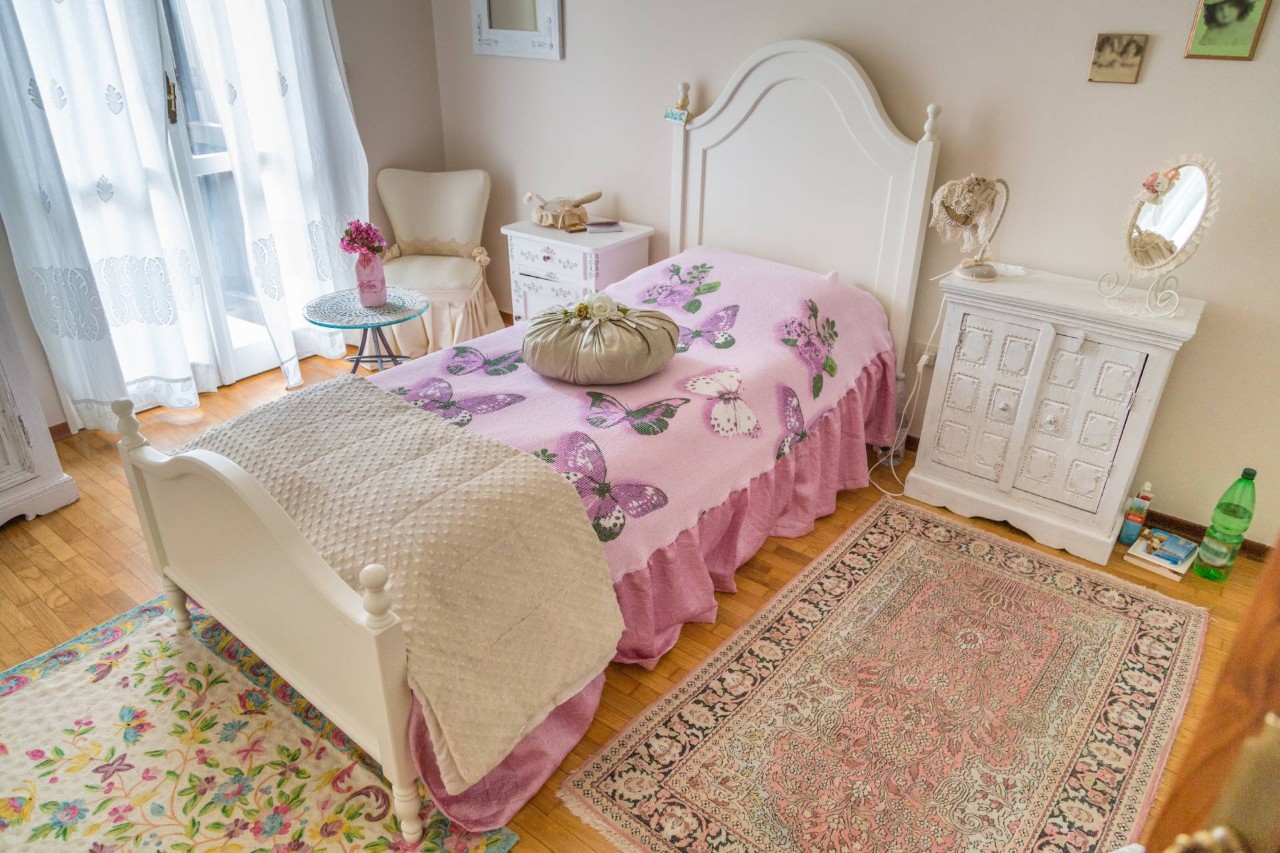 Bedroom decorated in the shabby chic style, featuring a white and pink color scheme near Bainbridge Island, WA