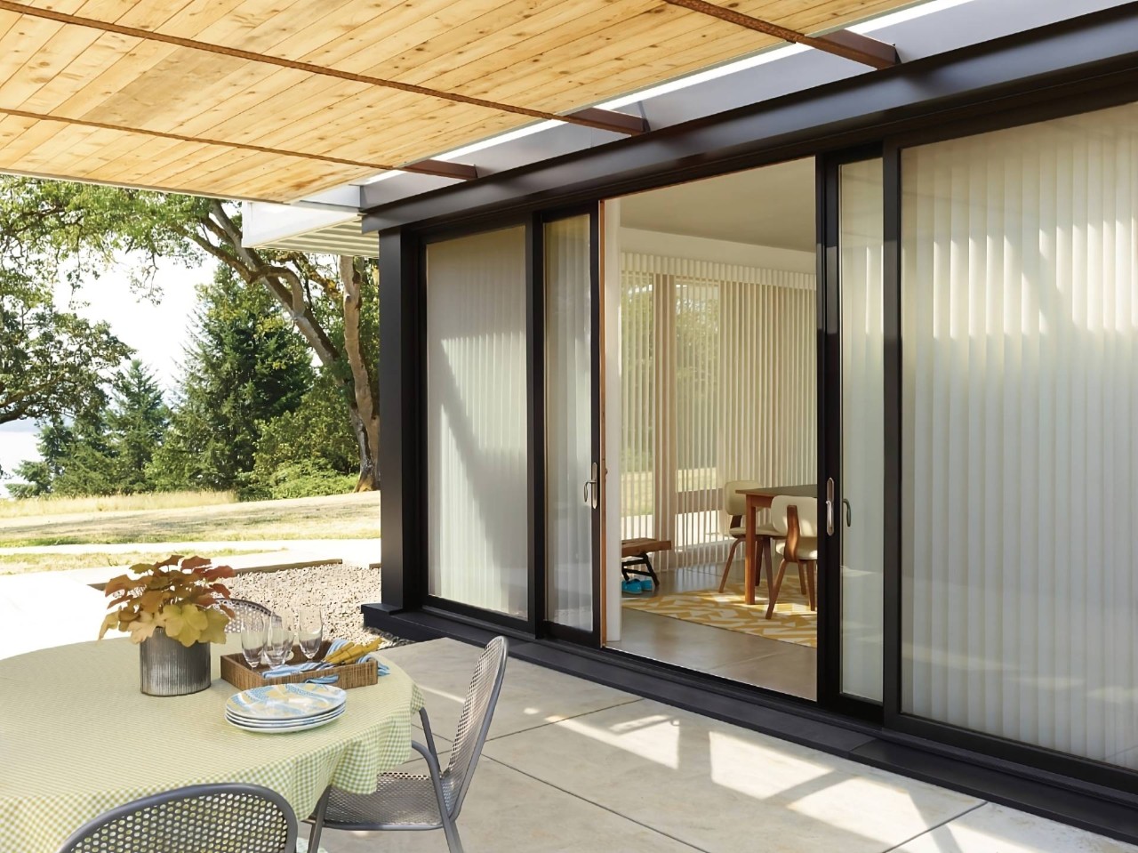 Hunter Douglas Luminette® Sheer Panels as Vertical Sunshades on a modern, matte black patio door at Eagle Harbor Window Coverings near Bainbridge Island, WA